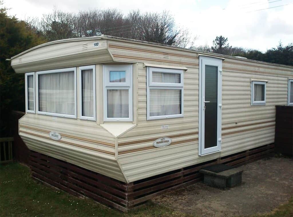 Static caravan on a grassy pitch