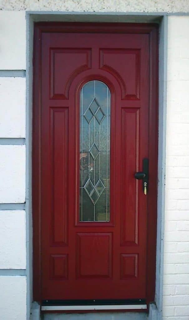 Red front door with decorative glass panel
