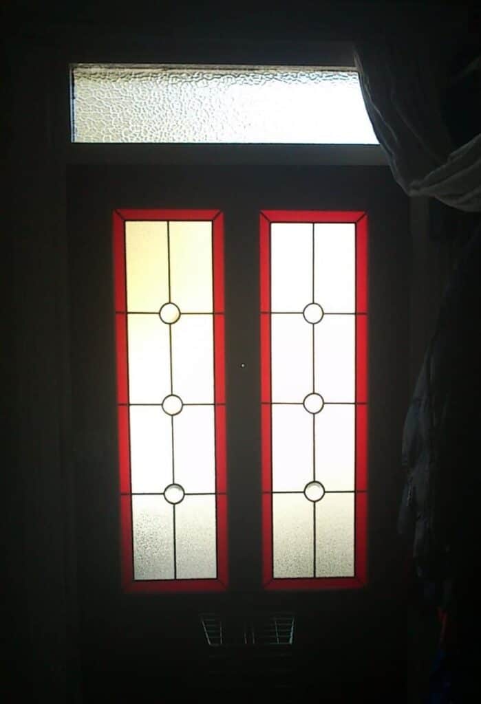 Double doors with stained glass panels.