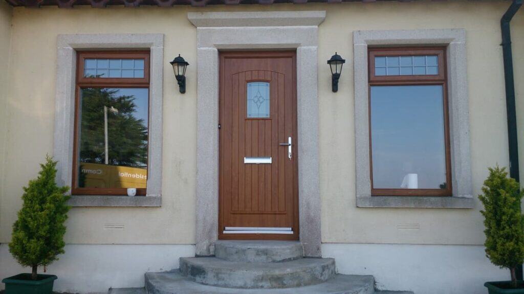 Brown house door with two windows