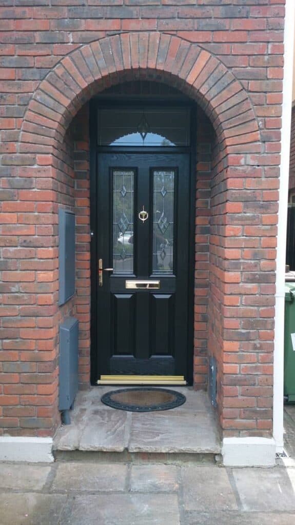 Black arched brick front door entrance