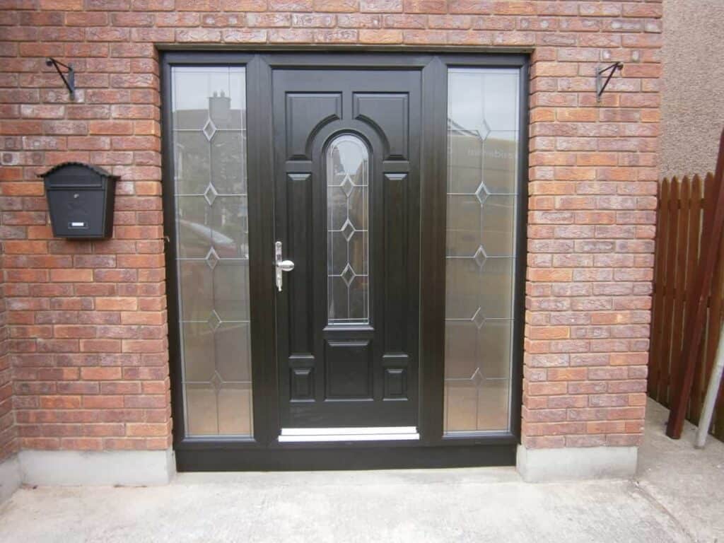 Modern black front door with glass panels.