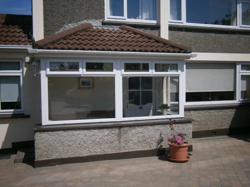 Front view of a sunlit conservatory extension.
