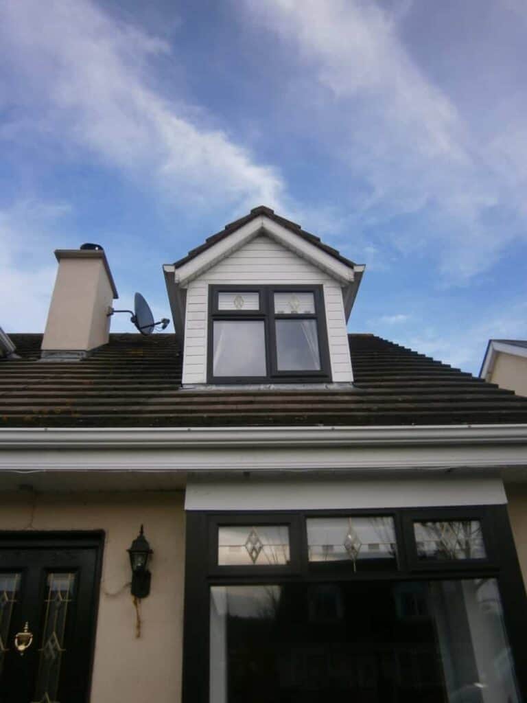 Modern dormer window on traditional house